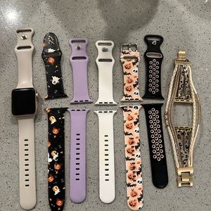 Rose Gold Apple Watch Series 3 with bands and chargers